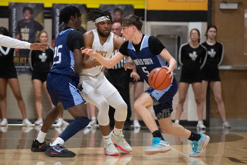 Joliet West's Jayden Martin defends against Plainfield South's Devin Tyda during a game Tuesday Feb. 14, 2023 at Joliet West  High School