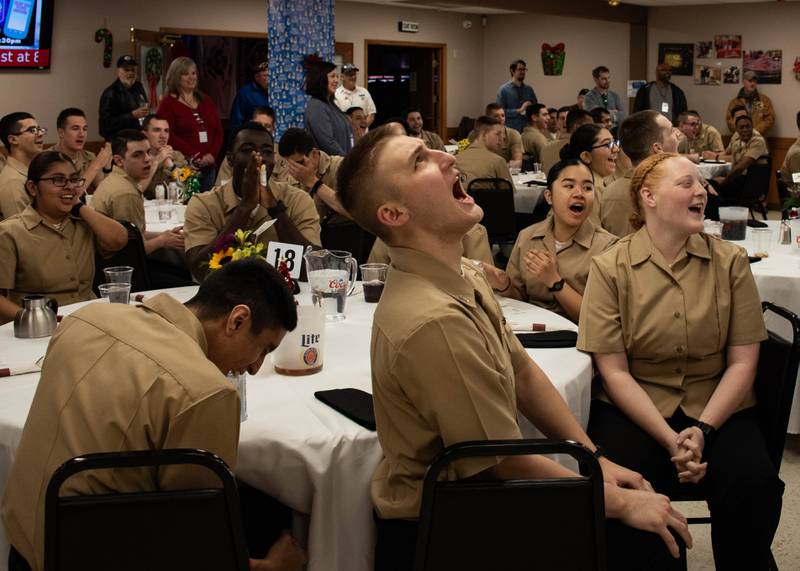 Recruits from the Great Lakes Naval Station enjoy a festive Thanksgiving meal at the McHenry VFW Post 4600 in McHenry on Thursday, Nov. 23, 2023. VFW members and volunteers helped keep the recruits spirits high by providing music, games and phone calls to home.