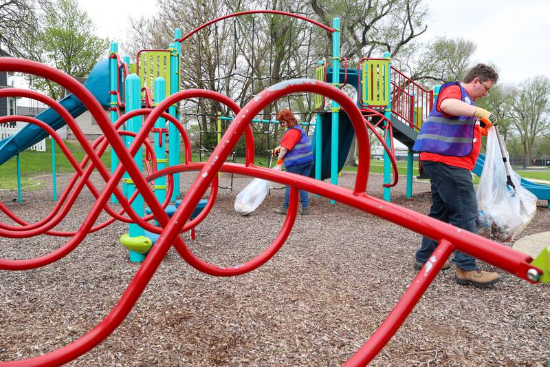 Volunteers Lisa Hassett, left, and Nicholas Scocozzo, with Dow Chemical in Kankakee, clean up Washington Park during the United Way of Kankakee & Iroquois Counties’ annual Day of Action on Wednesday, April 22, 2026.