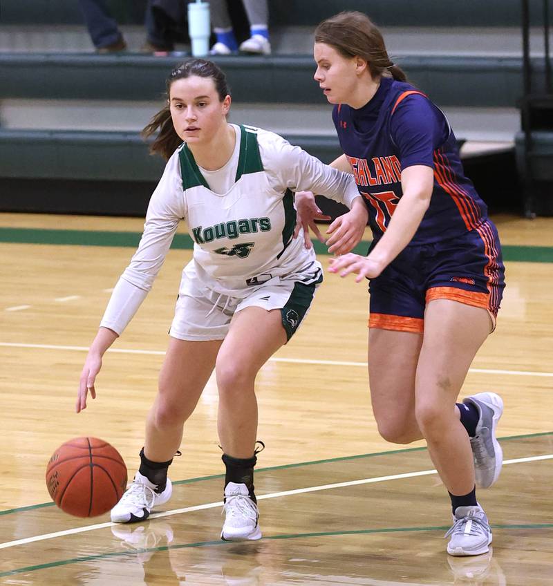 Kishwaukee College's Emily Gilbert tries to go around Highland Community College's Sarah Kempel during their game Thursday, Jan. 11, 2024, at Kishwaukee College in Malta.