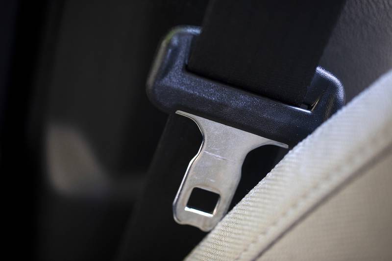 A seat belt for the right front passenger seat is shown in a vehicle.