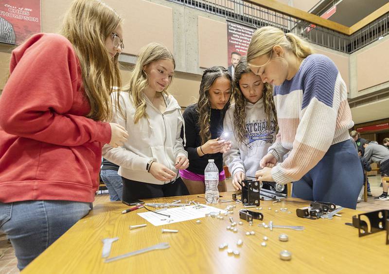 Dixon students Dakota Boswell (left), Eveline DeLeon, Kamille Prather, Sarah MacRunnels and Kassidy Mattson focus on their build Friday, April 26, 2024 at SVCC.