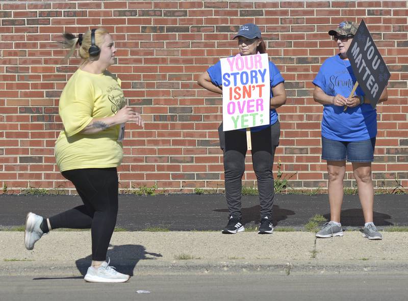 Many along the 5K course held up signs supporting the runners and walker in he annual Run Today for Tomorrow Saturday in Ottawa. The race is held in partnership with the Starved Rock Country Community Foundation with all proceeds helping fund counseling services, suicide prevention initiatives and a scholarship for students pursuing careers in mental health