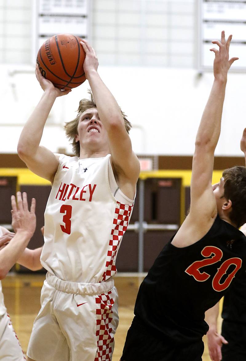 Huntley's Nathan Ary drives to the basket against McHenry’s Kayden Shatzer during a IHSA Class 4A Boys Regional basketball game Wednesday, Feb. 23, 2022, between Huntley and McHenry at Jacobs High School.