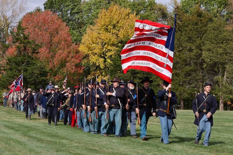 Soldiers march in a row during Shadows of the Blue and Gray event on Sunday, Oct. 13, 2024 at City County Park in Princeton.