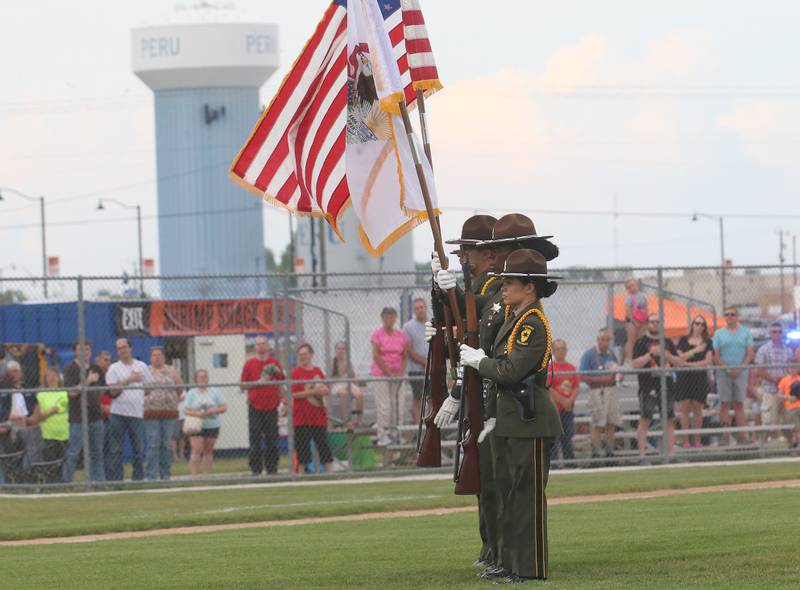 Members of the Illinois State Police Honor Guard display the colors during the National Anthem of the Illinois Valley Pistol Shrimp First Responder Night on Tuesday, June 17, 2025 at Schweickert Stadium in Peru.