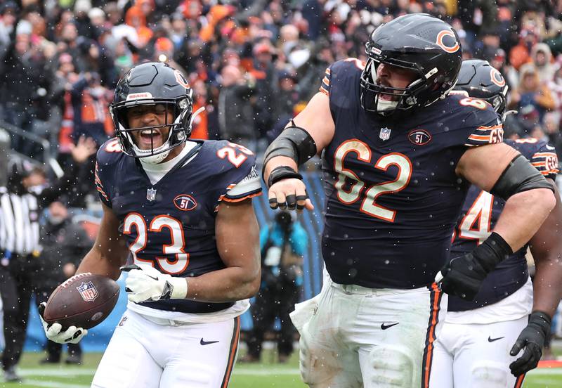 Chicago Bears running back Roschon Johnson celebrates his touchdown with guard Lucas Patrick during their game against the Atlanta Falcons Sunday, Dec. 31, 2023, at Soldier Field in Chicago.