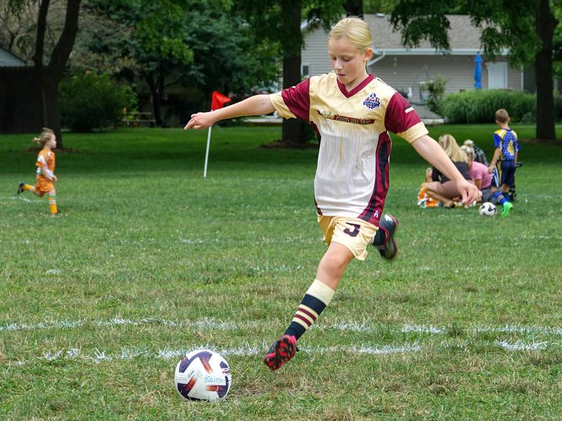 Kiera Faupl kicks soccer ball on Saturday, August 17, 2024 at Peck Park in Ottawa.