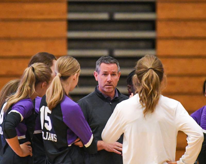 Downers Grove North's head coach Mark Wasik talks to the team during a timeout on Tuesday Oct. 22, 2024, while traveling to take on York High School in Elmhurst.