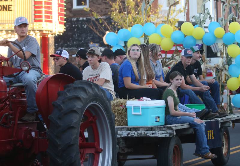 Princeton High School FFA students ride a float during the Homecoming parade on Thursday, Oct. 3, 2024 downtown Princeton.