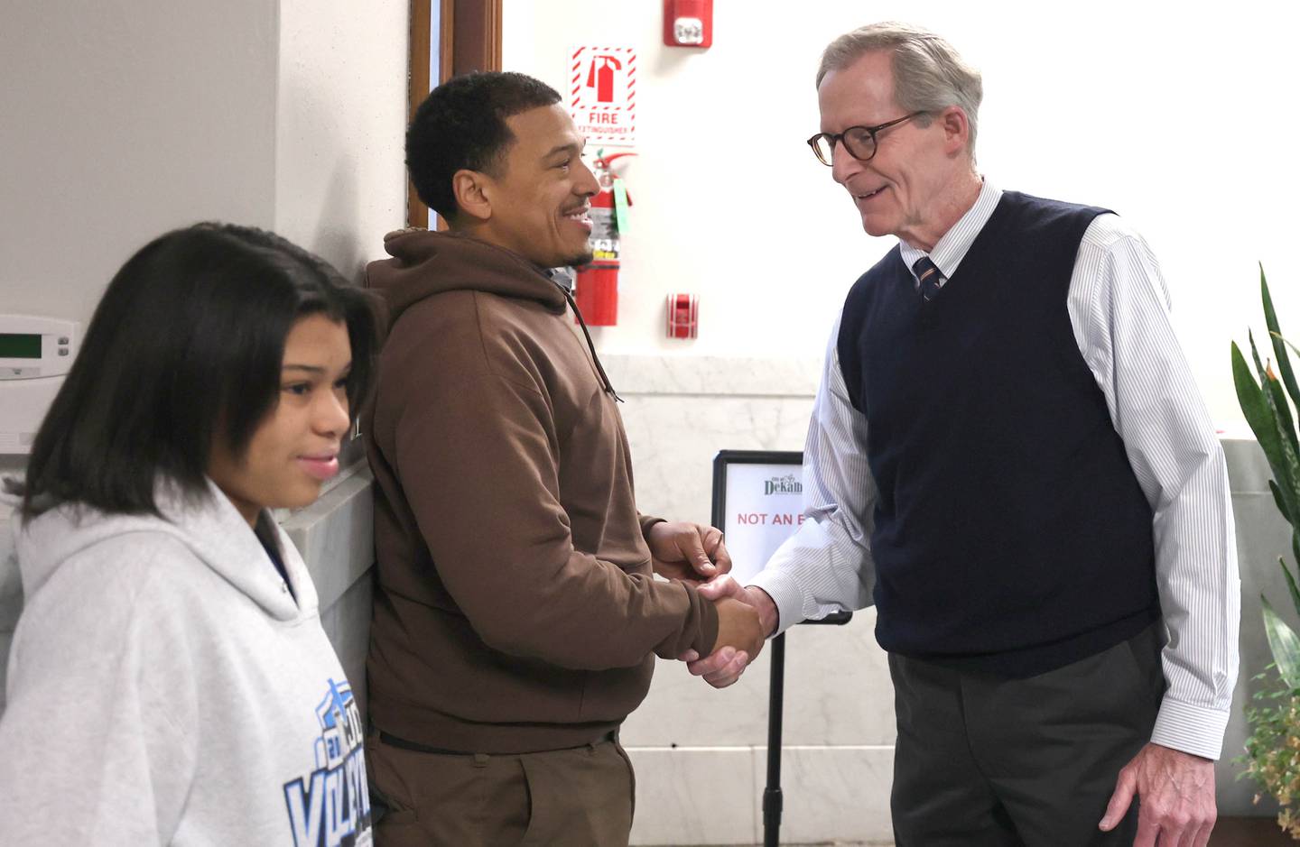 DeKalb City Manager Bill Nicklas greets John Walker, and his daughter Jayla, Monday, Dec. 12, 2022, at City Hall as Walker waits in line to file his papers to run for election in the 7th Ward in the DeKalb City Council. Candidate filing for the April election opened Monday morning at 8:30 a.m. at City Hall.