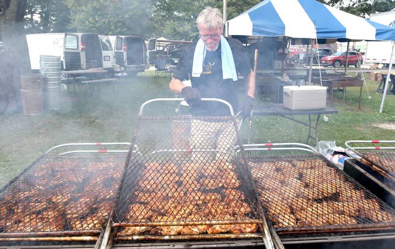 Larry Haughty, from 5-B's Catering in Waterman grills some chicken Wednesday, Sept. 7, 2022, on opening day of the Sandwich Fair. The fair continues this week through Sunday.