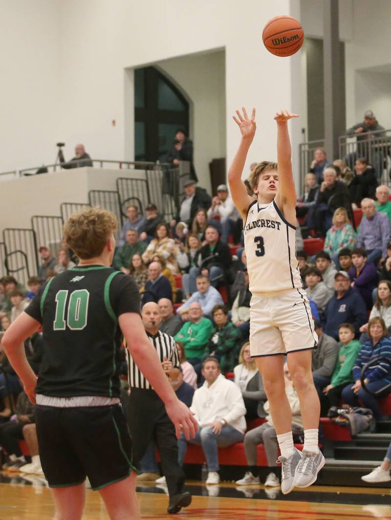 Fieldcrest's Edmond Lorton shoots a three-point basket over Rock Falls's Kuitm Held during the 49th annual Colmone Classic on Saturday, Dec. 9, 2023 at Hall High School.