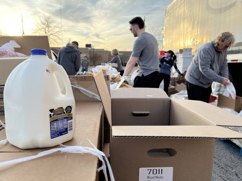 Volunteers assist with a mobile food pantry event on Monday, Nov. 6, 2023, outside of a Joliet veteran affairs clinic.