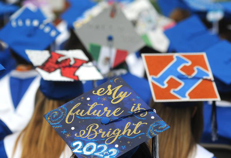 Decorated caps on Sunday, May 15, 2022, during the Woodstock High School graduation ceremony in Woodstock.