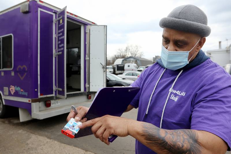 Live4Lali outreach coordinator Luis Aponte shows a Narcan injection device at their mobile unit on Wednesday, March 10, 2021 at A.J.M. Auto in McHenry.  The mobile unit is there in McHenry every Wednesday from 1pm to 4pm and then at the Woodstock Metra train station near the historic Woodstock Square from 5-7pm. The group trains people on Narcan use, as well as provide substance abusers with clean paraphanalia to reduce disease transmission and accidental overdoses.