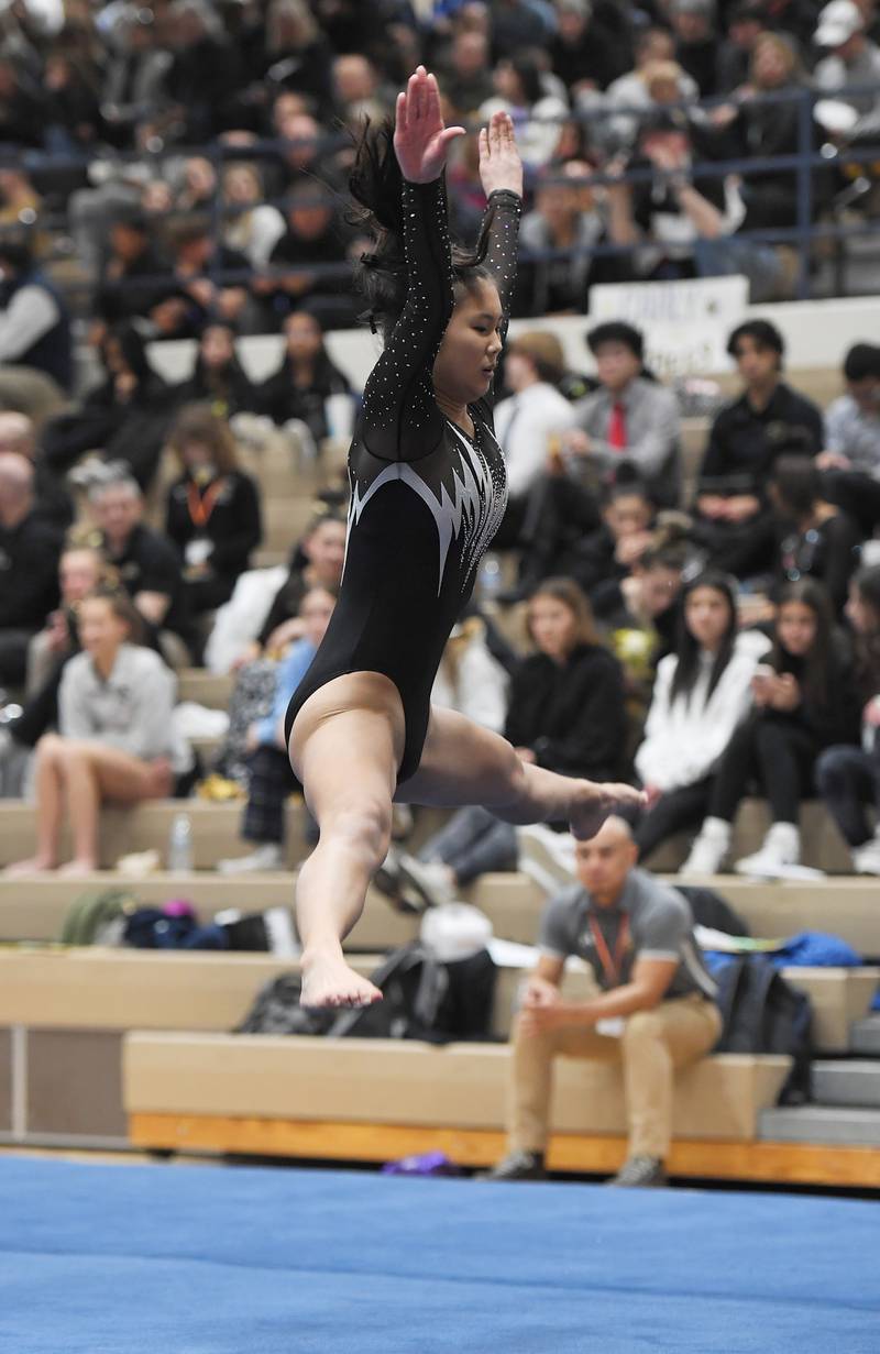 Kaneland’s Kaci Randall on the floor exercise at the Lake Park girls gymnastics sectional meet in Roselle on Monday, February 6, 2023.