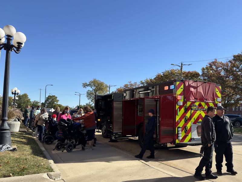 Fox Development Center residents get to see the inside and learn about the fire trucks, ambulances and police vehicles on Thursday morning.