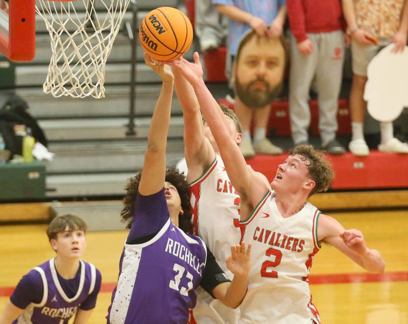 Rochelle's Martiese Pogue and L-P's Regan Doerr battle for a rebound on Friday, Feb. 13, 2026 in Sellett Gymnasium at L-P High School.