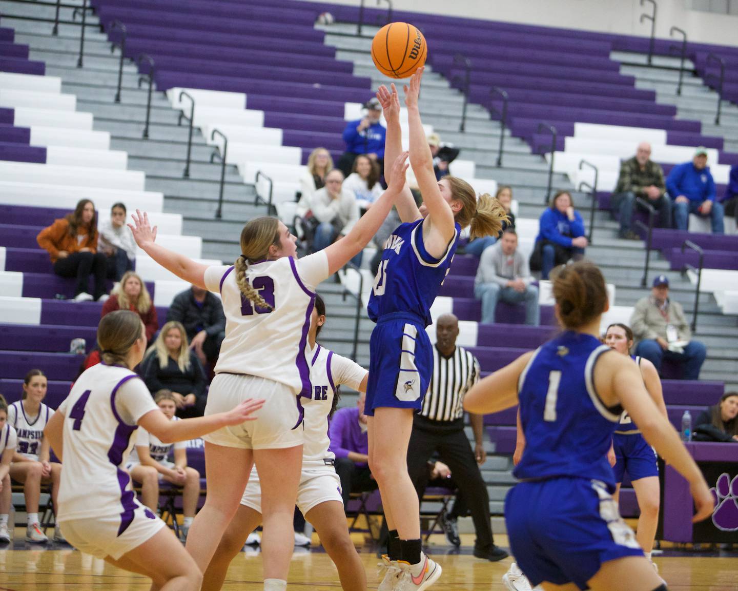 Geneva's Bridget Hecker shots a jumper over Hampshire's Autumn Kriegel on Friday, Nov.22.2024 in Hampshire.