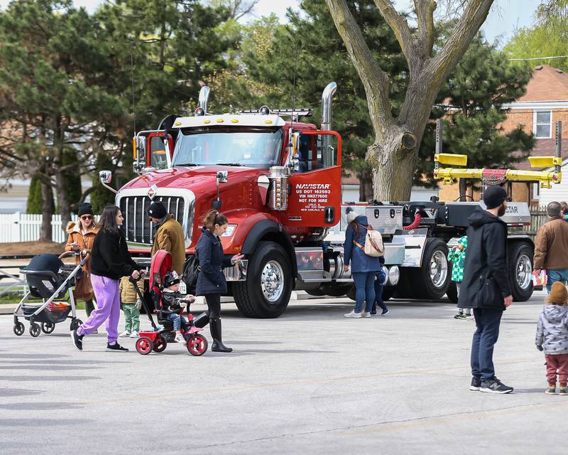 Parents with their children attend the La Grange Touch a Truck event. April 22, 2023.