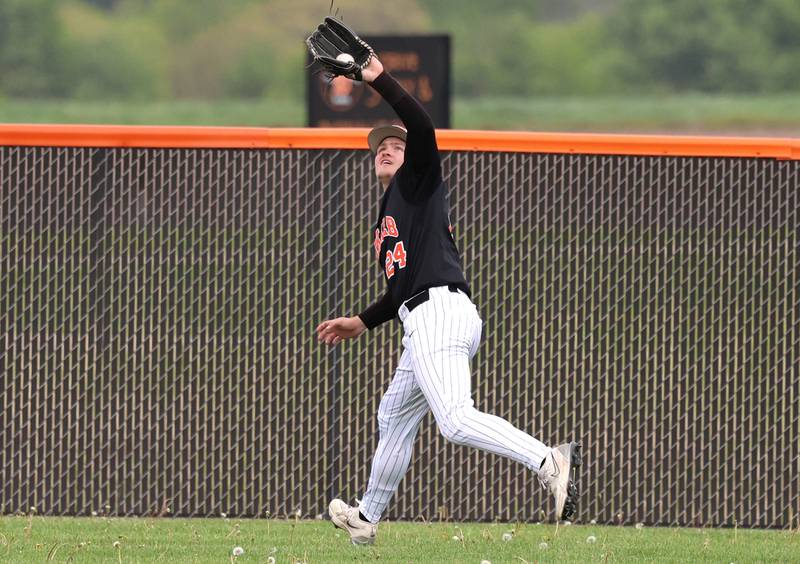 DeKalb's Evan Johnson makes a running catch in the outfield Tuesday, May 5, 2026, during their game against Neuqua Valley at DeKalb High School.