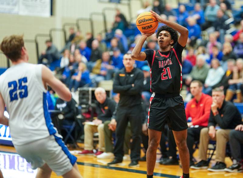 Batavia’s Xavier Justice (21) shoots a three pointer against Geneva during a basketball game at Geneva High School on Friday, Feb. 7, 2025.