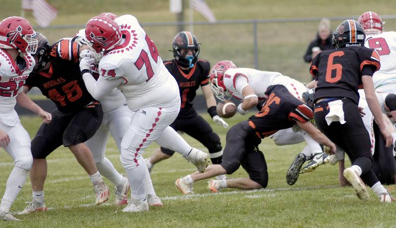 South Beloit's Chase Harrington is hit hard by Milledgeville's Spencer Nye. The Milledgeville Missiles defeated the South Beloit SoBos 22-6 in Round 2 of the I8FB playoffs. The game took place at Milledgeville on Saturday, November 8th, 2025