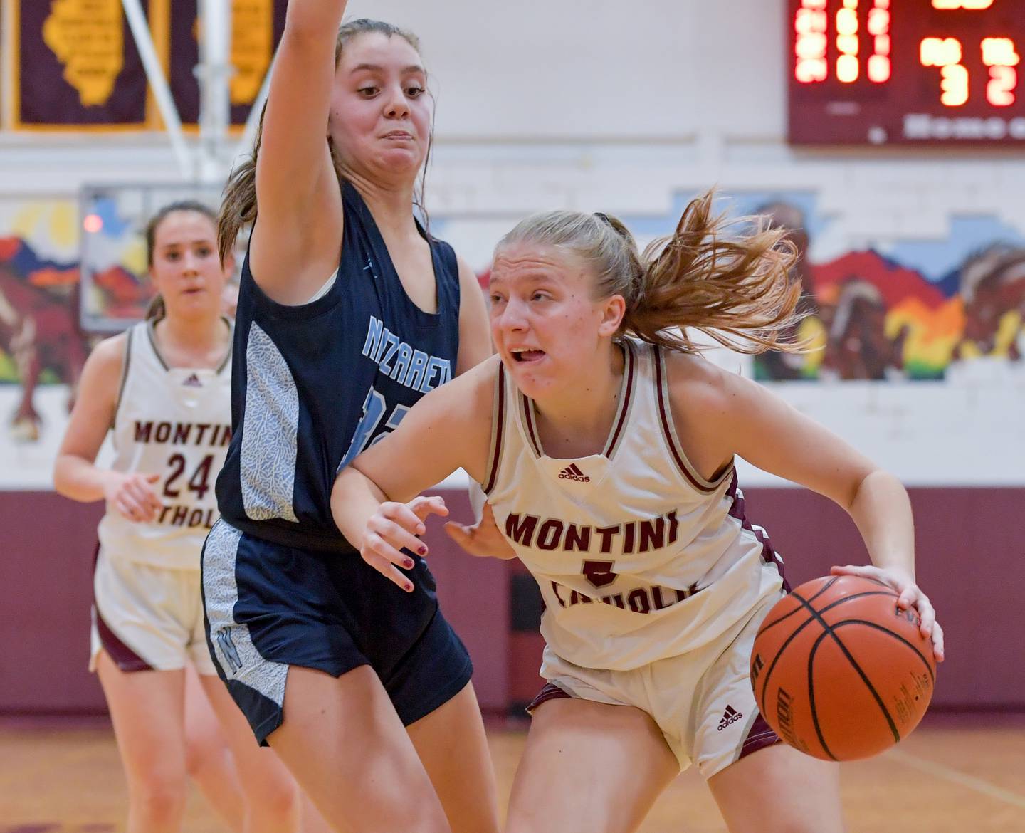 Montini's Victoria Matulevicius (5) drives in for a shot against Nazareth during the semifinals of the Montini Christmas Tournament on Thursday, Dec. 29, 2022.