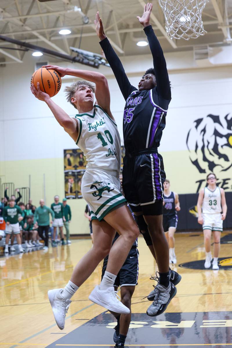 Bishop McNamara's Coen Demack goes for a layup during the Fightin' Irish's 66-52 victory over El Paso-Gridley in the IHSA Class 2A Herscher Regional championship on Friday, Feb. 27, 2026.
