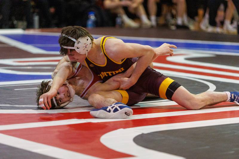 Montini's Bobby Ruscitti and Marist's Dylan Weber competes in the 126 lb match  at the Marmion Class  2A Dual Team Sectional on Thursday, Feb. 5,2026 in Aurora.
