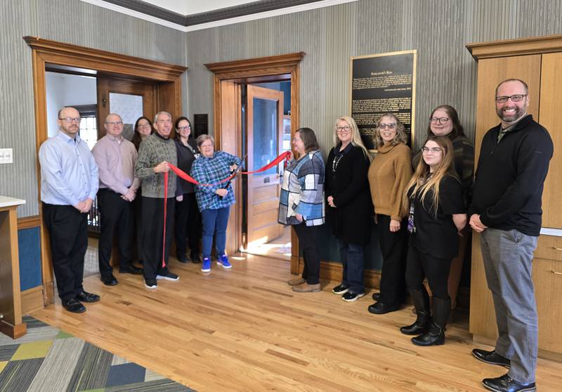 Members of the library and chamber meet for a ribbon cutting ceremony for the new sewing room at Streator Public Library. (From left) Derek Barichello, Streator Chamber director; Ben Hiltabrand, Chamber board president; Beth Palm, Chamber board and ambassador member; Greg Tullis, Streator Rotary Club; Laura Mattson, Chamber ambassador; Barb Ehling, Streator Rotary Club; Melissa Badger, director of Streator Public Library; Sandy Austin, Streator Public Library Board; Judy Booze, Chamber ambassador/Rotary Club; Nicole Close, Streator Public Library; Charlotte Badger, Streator Public Library; and Jeffrey Alstadt, Rotary Club.