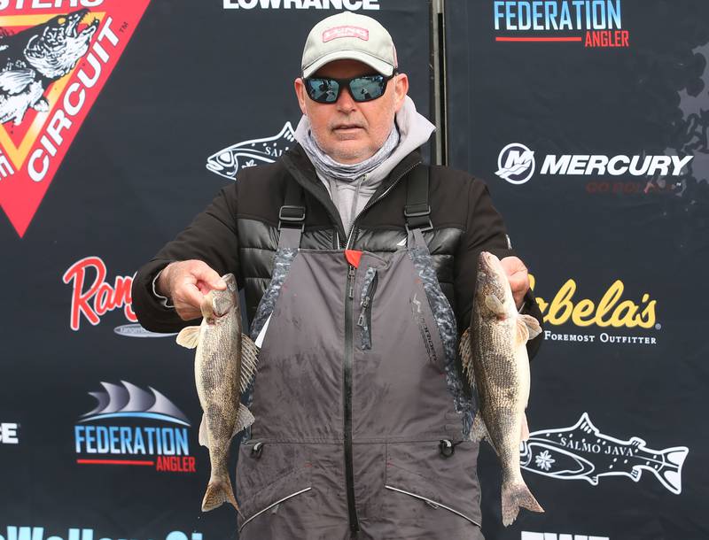 Joe Baird of DeKalb, holds his walleye fish that he caught during the annual Masters Walleye Circuit tournament on Friday, March 21, 2025 at the Spring Valley Boat Club.