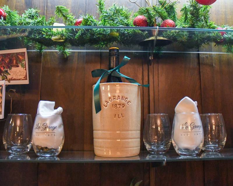 Items for sale at The Samuel Vial House Museum sit on display during the Holiday Sip and Sweet Tour event held on Sunday Dec. 17, 2023.