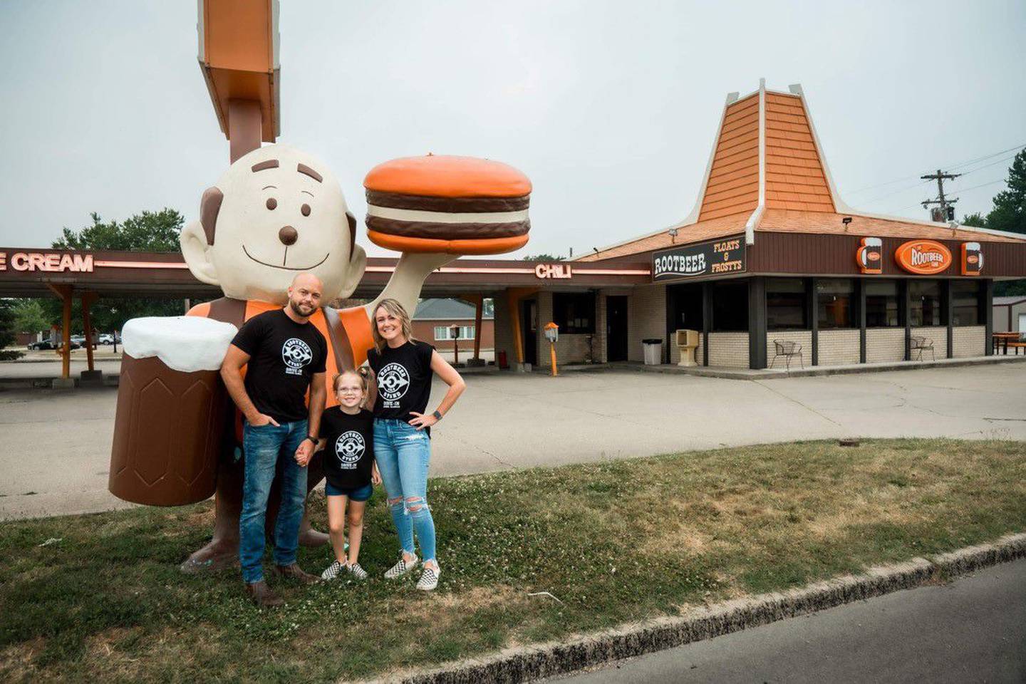Elena Ridley announced on social media Monday she and her husband, Joe, purchased the Rootbeer Stand in Oglesby. They are pictured with their daughter Georgia in front of "Woody" the hamburger man.