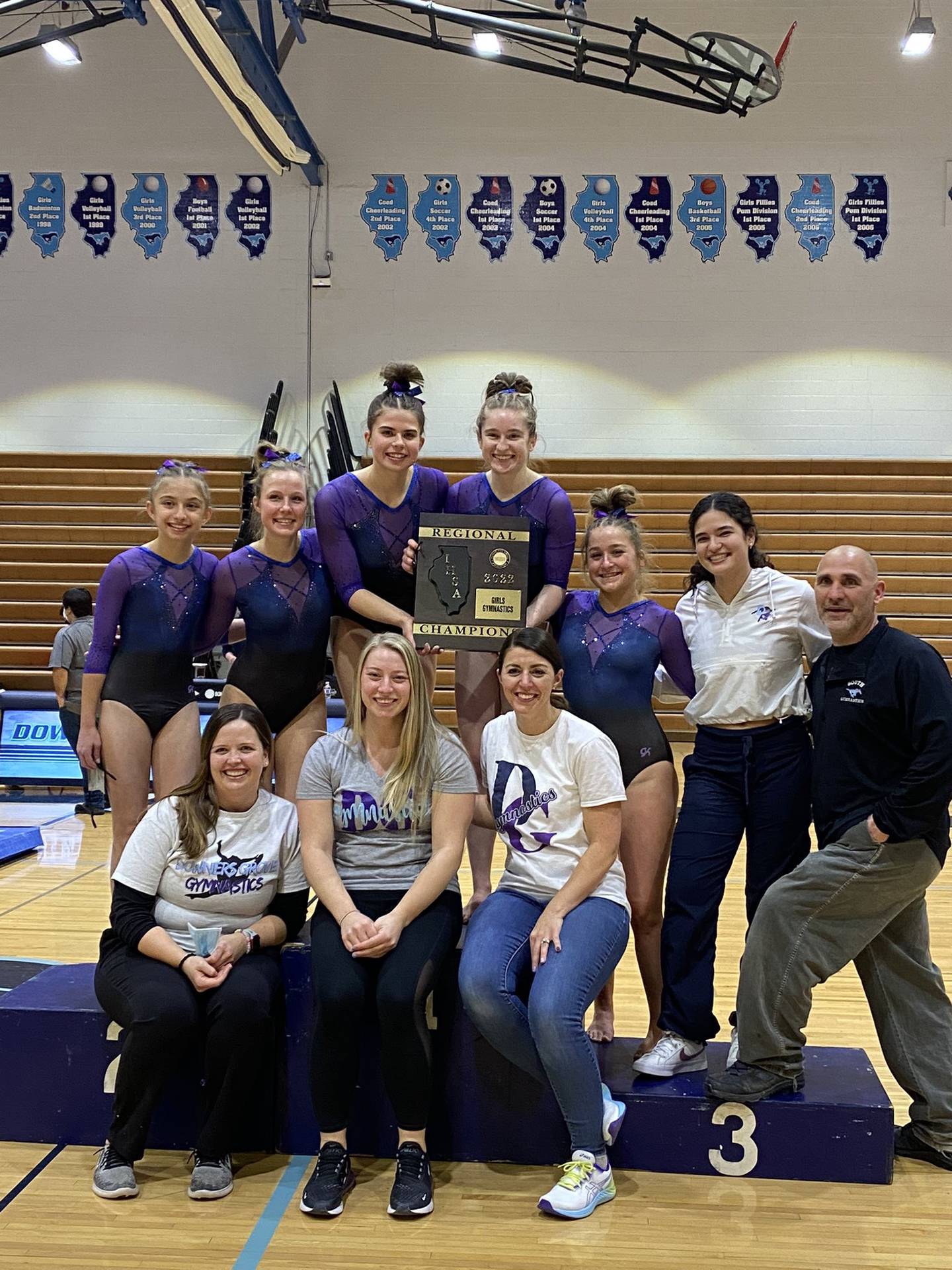 Downers Grove co-op head coach Kristyn Campos (bottom right) with her team.