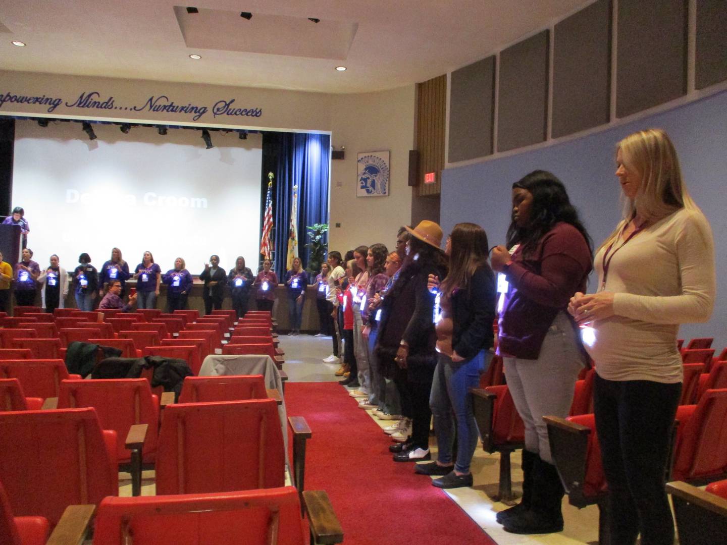 Women line the aisles at Hufford Junior High School in Joliet on Thursday at Take Back the Night to represent the women and children who have been victims of domestic violence in Will County since 2012. Oct, 20, 2022.