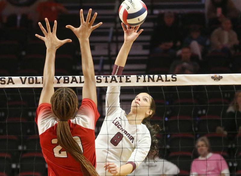 Lockport's Kyla Mitchell spikes the ball past Marist's Cassidy Cage during the Class 4A State semifinal game on Friday, Nov. 15, 2024 at CEFCU Arena in Normal.