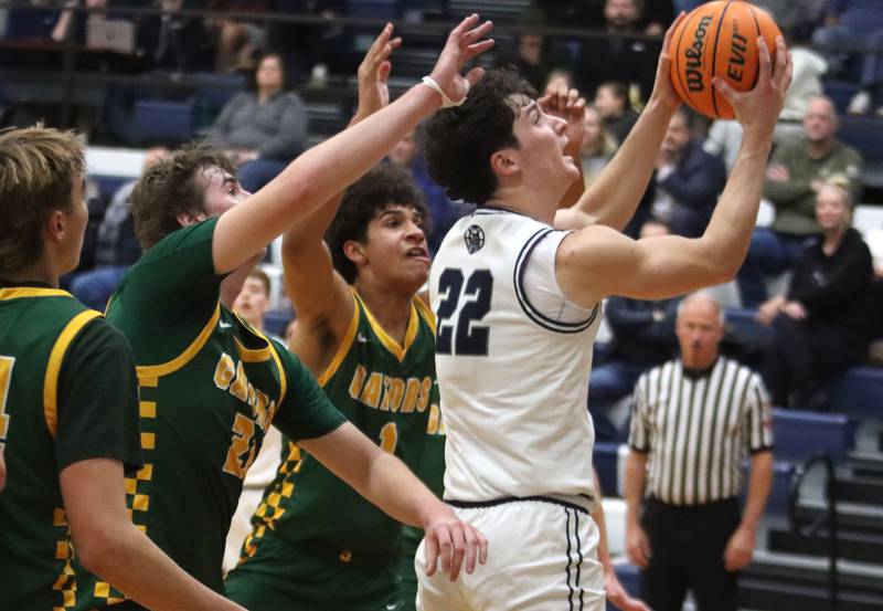 Cary-Grove’s Adam Bauer works under the hoop against Crystal Lake South in varsity boys basketball on Wednesday, Dec. 3, 2025, at Cary-Grove High School in Cary.