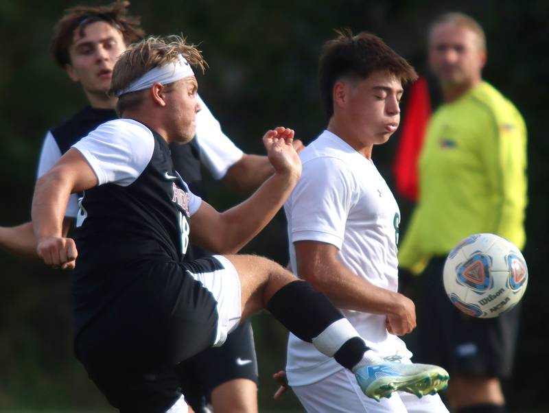 Crystal Lake South’s  Hayden Stone, right, battles Prairie Ridge’s Gabriel Porter, left, in varsity soccer on Thursday, Sept. 19, 2024, at Prairie Ridge High School in Crystal Lake.