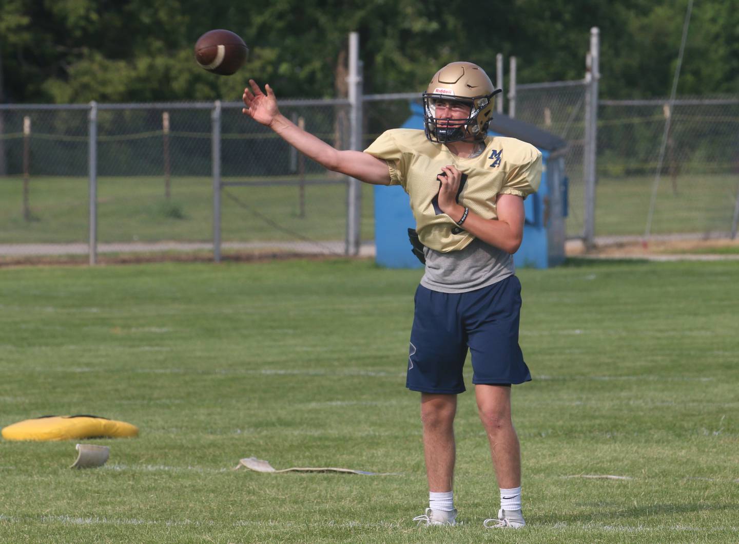 Marquette quarterback Anthony Couch practices warming up during football camp on Monday, July 24, 2023 on the practice field next to Gould Stadium in Ottawa.