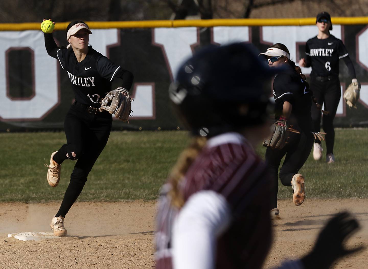 Huntley's Aubrina Adamik throws to first base to get out Prairie Ridge's M-K Center as she turns a double play during Fox Valley Conference softball game on Monday, April 14, 2025, at Prairie Ridge High School in Crystal Lake.