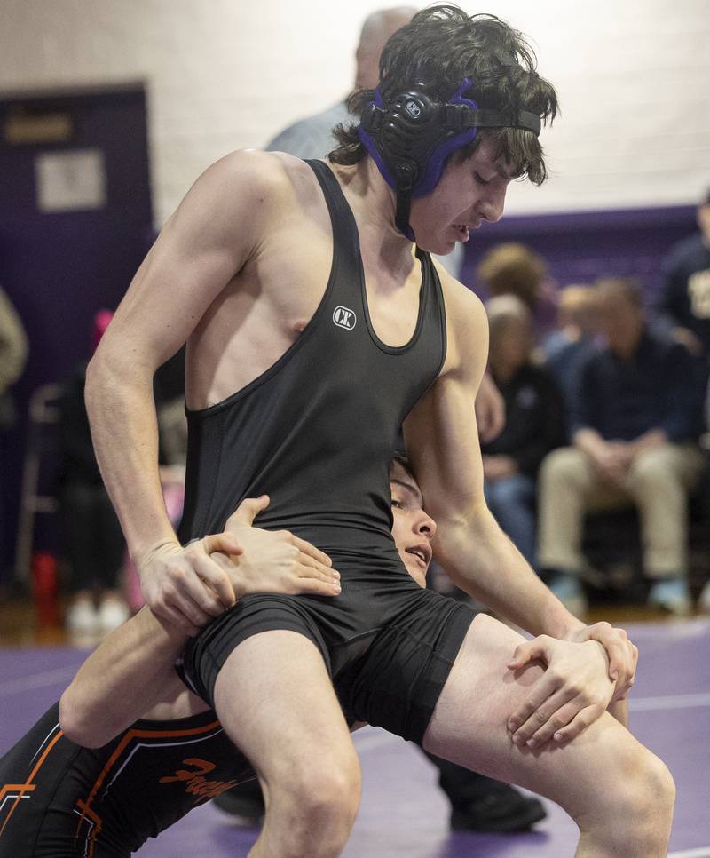 Dixon’s Channing Sarver works against Freeport’s Thomas Olson Tuesday, Jan. 13, 2025, during a triangular meet with Sterling at Dixon High School.