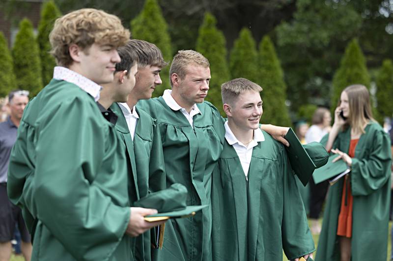 Friends and graduates pose for photos outside of Rock Falls High School Sunday, May 28, 2023.