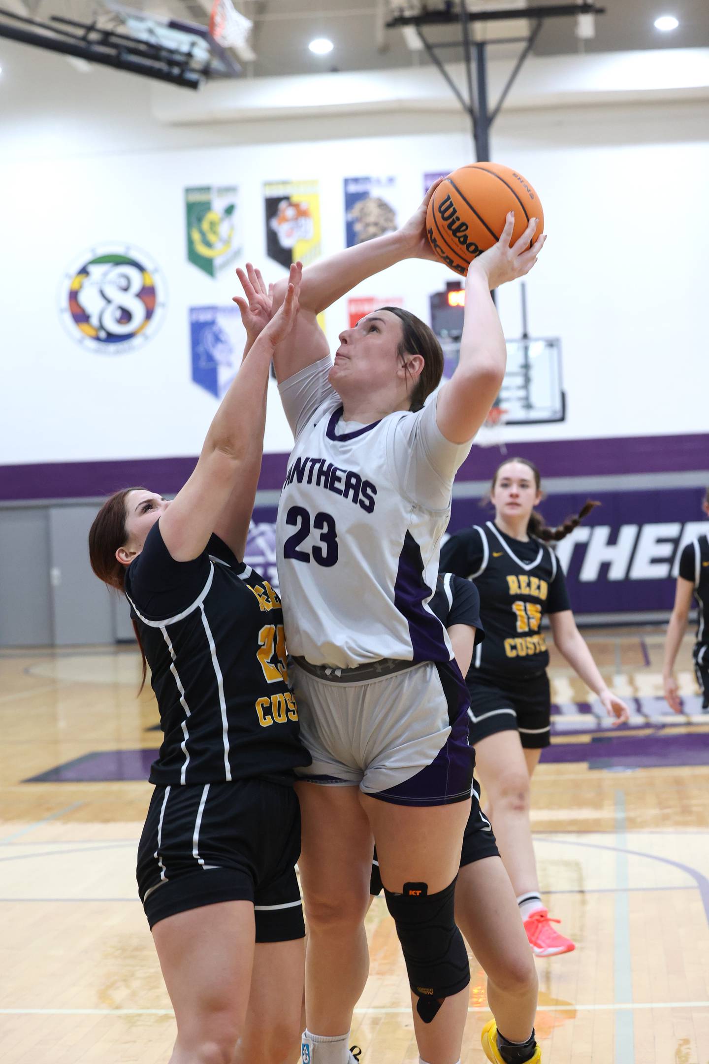 Manteno's Maddie Gesky shoots under pressure from Reed-Custer's Brooklyn Gonzalez during Reed-Custer's 45-42 victory over Manteno on Monday, Feb. 2, 2026.