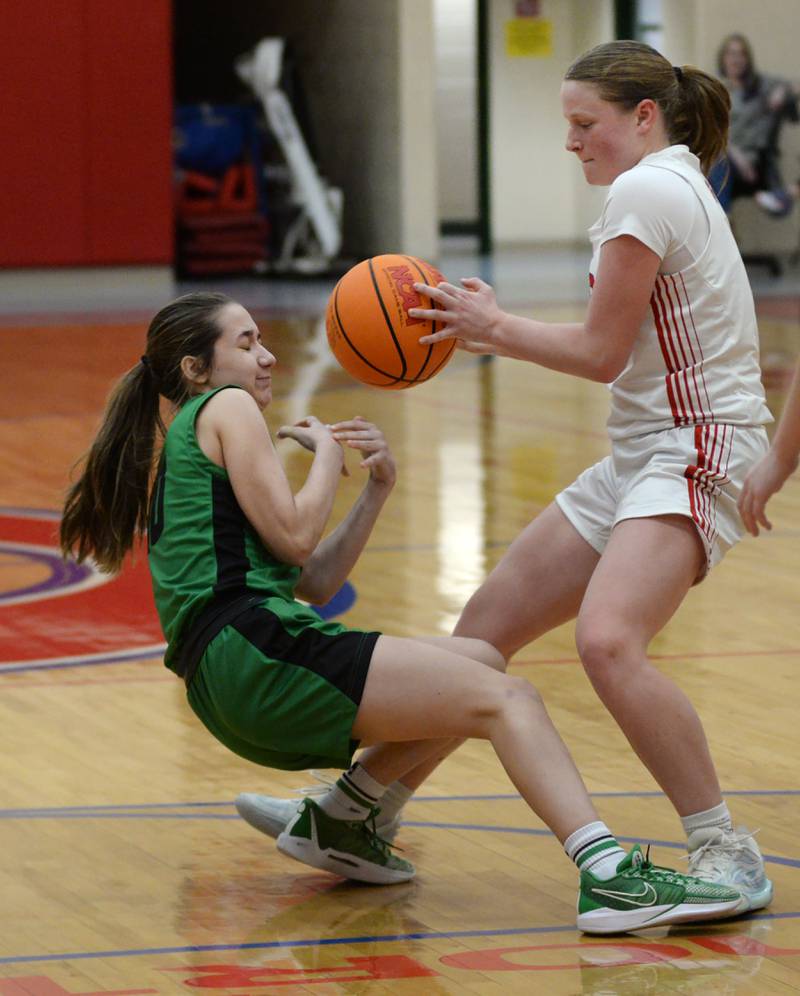 Oregon's Madison Shaffer (1) and Rock Falls' Abbygayle Schofield (10) fight for a loose ball during 2A regional action on Saturday, Feb. 15, 2025 at Oregon High School.