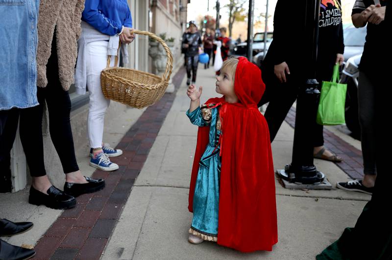 Cassidy Varsho, dressed as a witch from the Hocus Pocus movies, goes trick-or-treating at Geneva businesses on Thursday, Oct. 27, 2022.