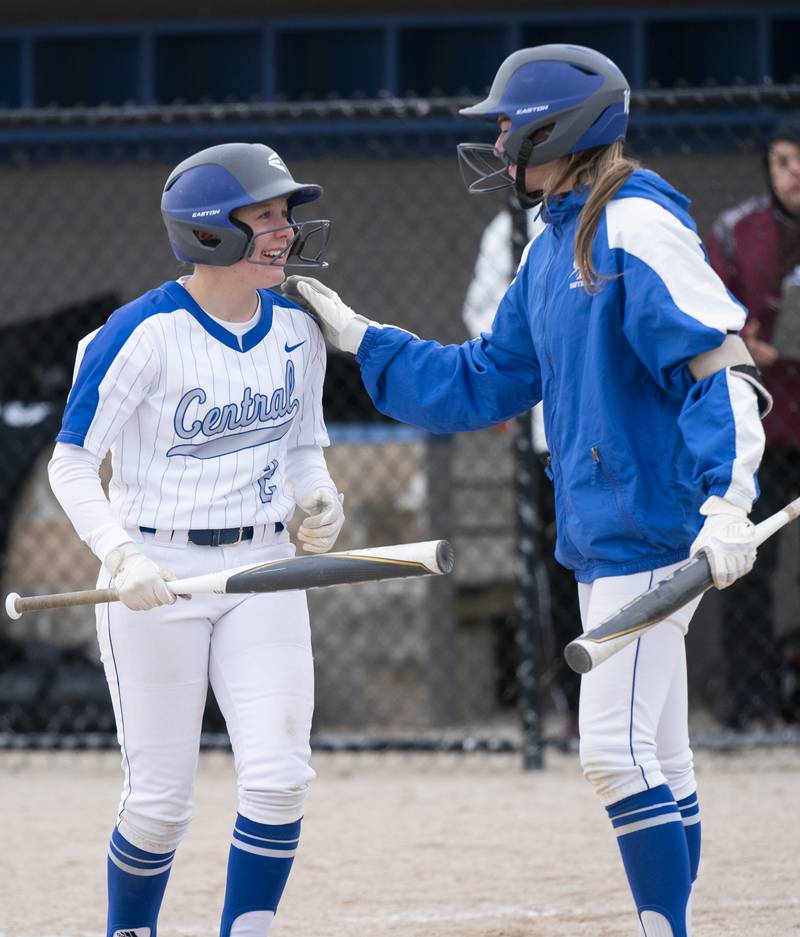 Burlington Central's Lauren Knief, right, congratulates Alyssa Becker after she scored a run during their game against Prairie Ridge on Wednesday, April 27, 2022 at Burlington Central High School. Ryan Rayburn for Shaw Local