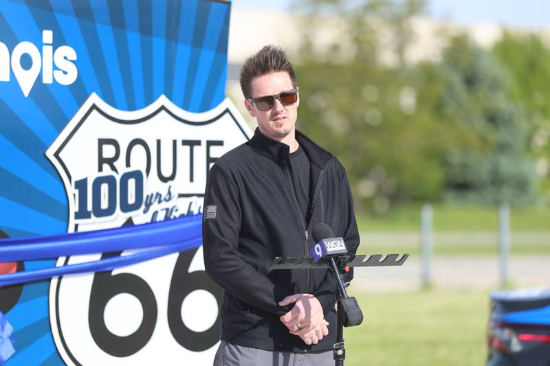 Artist Tim Harmon, of Harmonic Designs, speaks at the unveiling of his new Route 66 sculpture along South Chicago Street at the Route 66 Raceway on Tuesday, May 12, 2026 in Joliet.