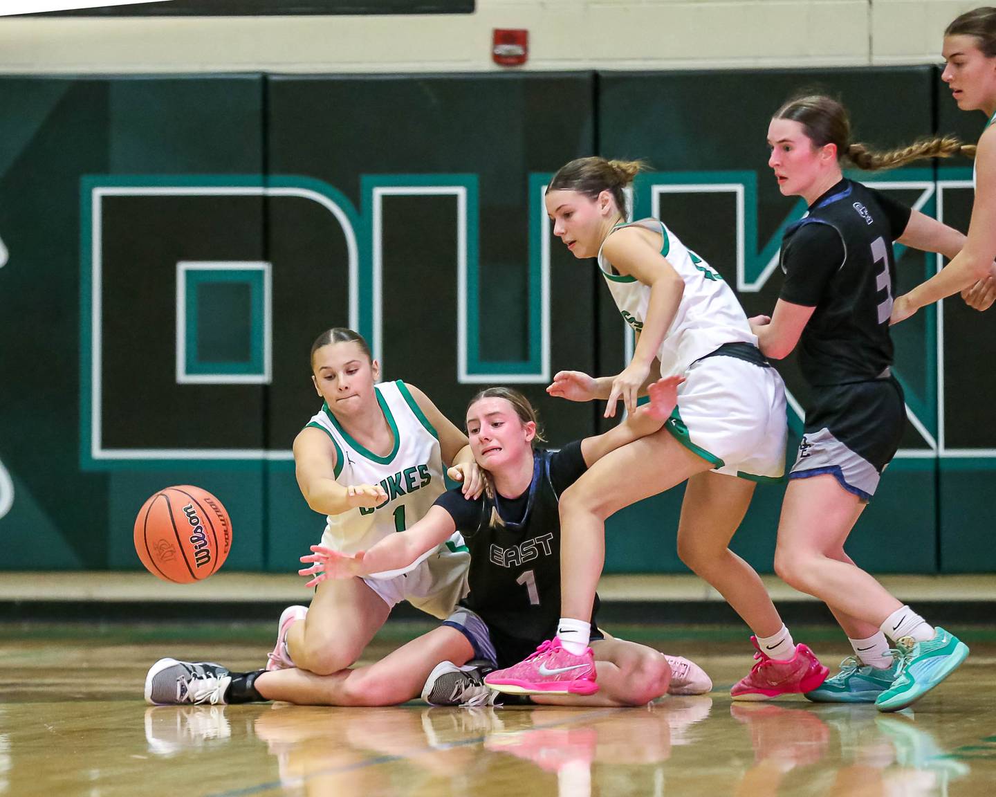 Oswego East's Aubrey Lamberti (1) reaches for a loose ball in their York Thanksgiving Tournament game between Oswego East at York on Monday, Nov 18, 2024  in Elmurst.